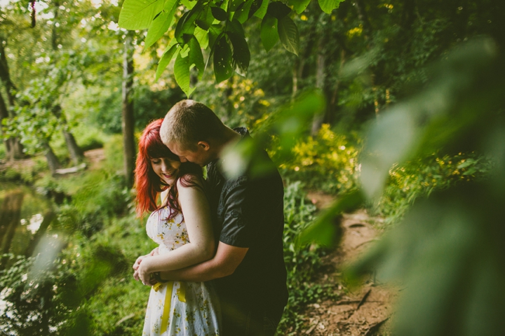 Couple hugging by water