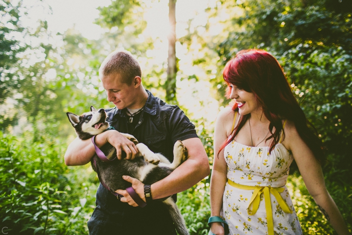 Man holding husky puppy