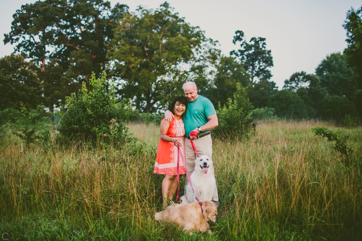 Couple and two golden retrievers