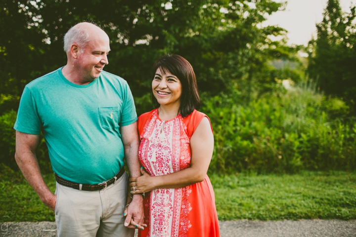 Couple holding hands laughing