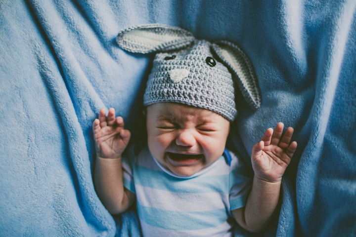 Baby crying in bunny hat