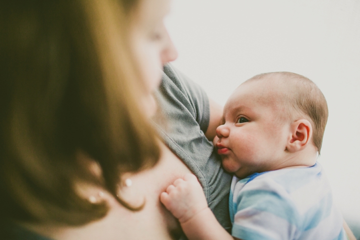 Baby being held by mother