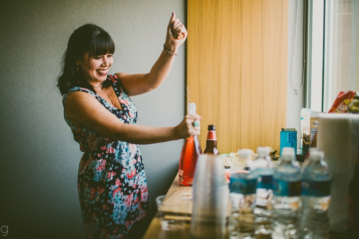 Girl popping champagne