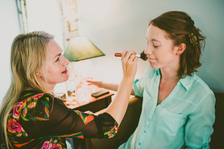 Bride putting on makeup