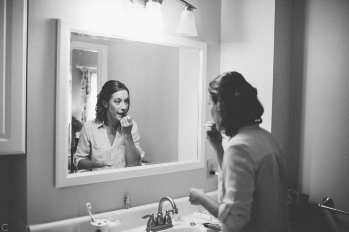 Bride putting on makeup