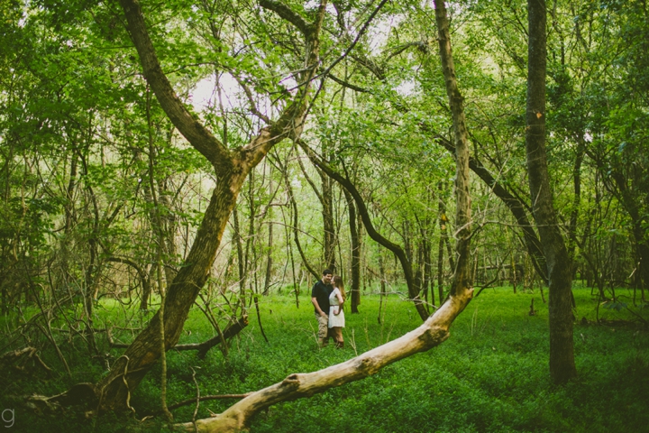 Couple standing in forest