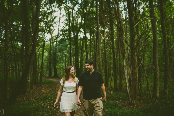 Couple walking through forest