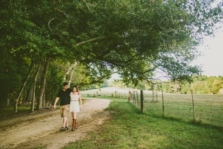 Man and woman walking along dirt path