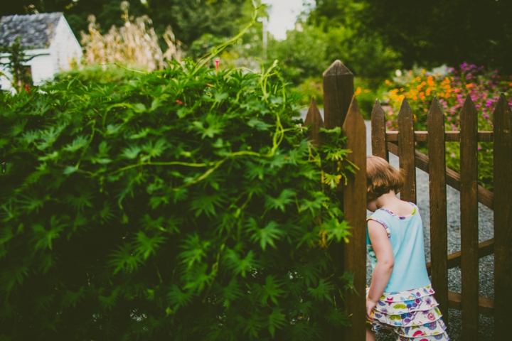 Girl walking through fence