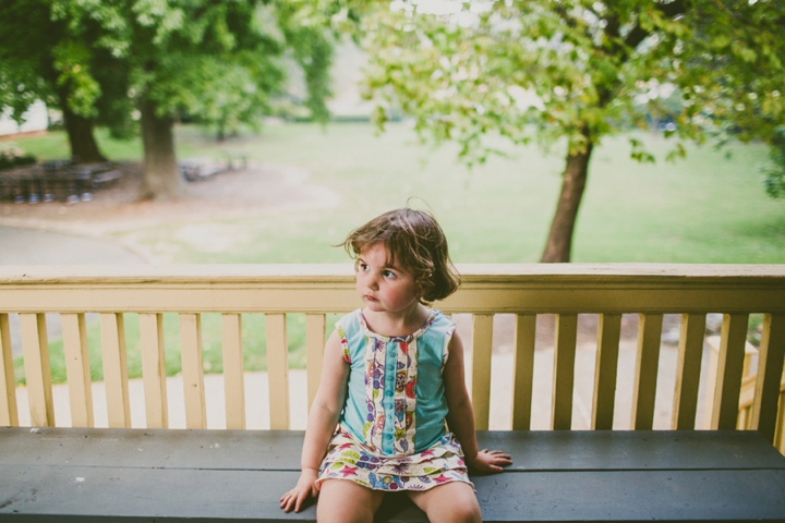Girl sitting on porch
