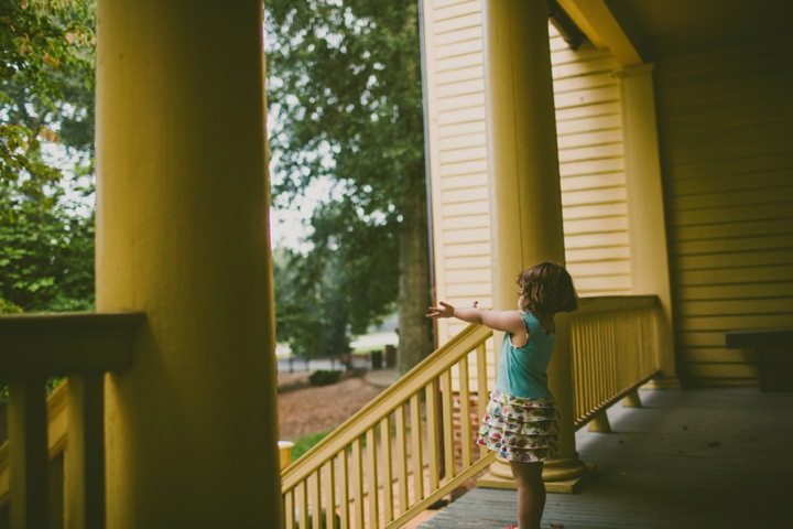 Girl standing on porch