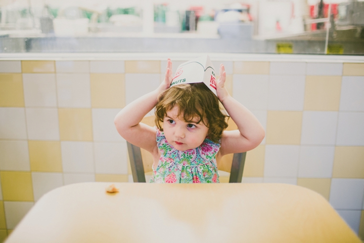 Kid in Krispy Kreme donuts