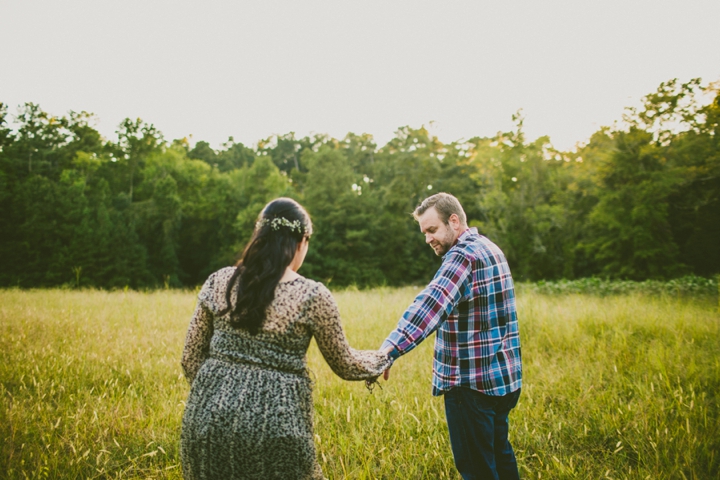 Couple walking through field