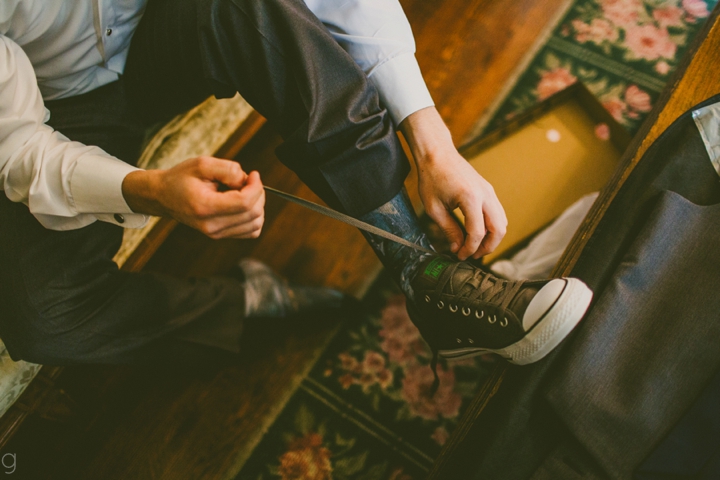 Groom tying his shoes