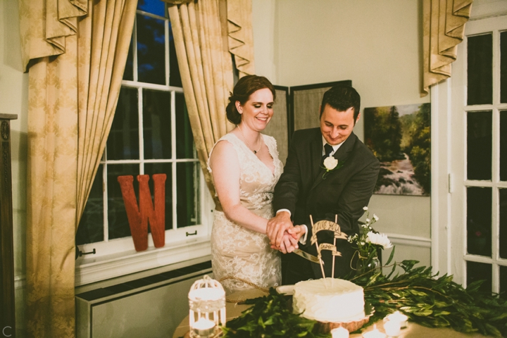 Bride and groom cut cake