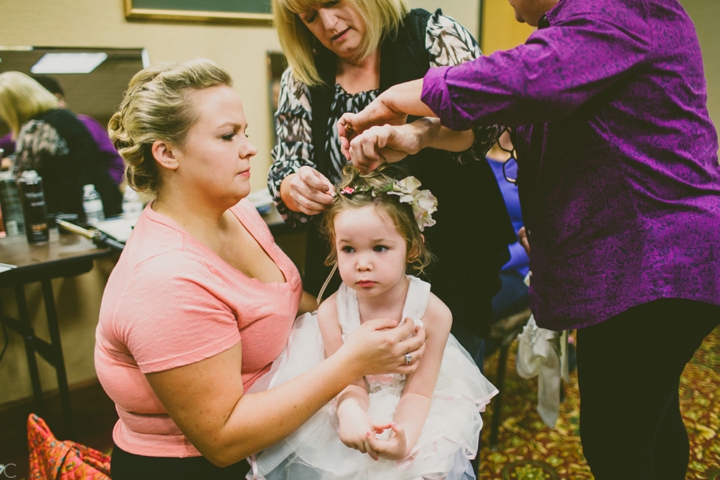 Flower girl sitting on lap