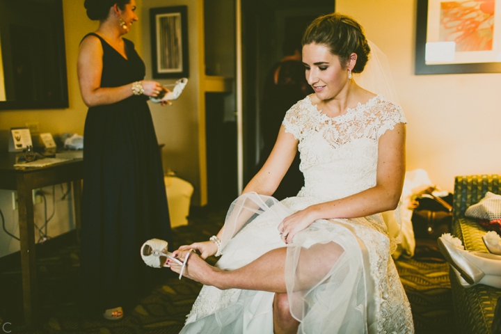 Bride putting on shoes
