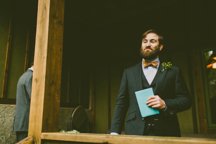 Groom standing on porch
