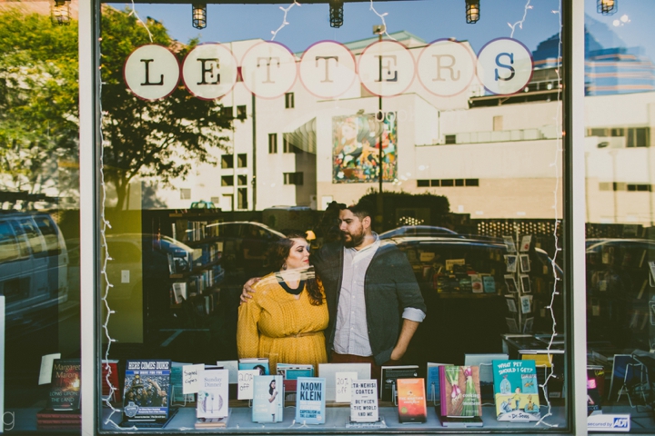 Couple standing in bookstore window