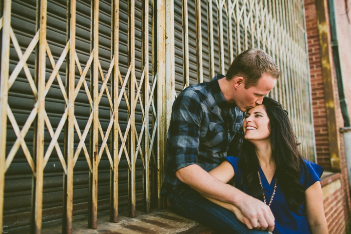 Husband kissing wife on forehead