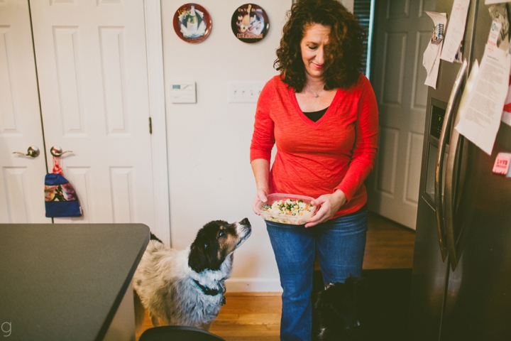 Woman feeding dog