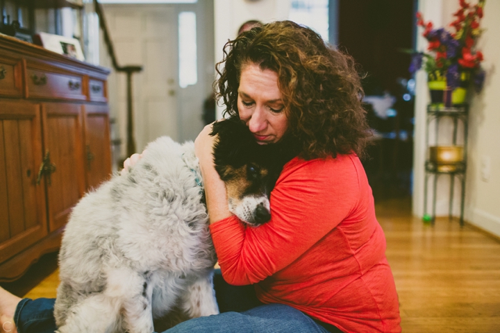 Woman holding her dog