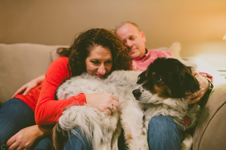 Woman snuggling with dog