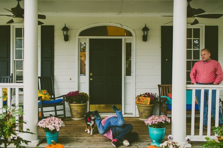 Kids wrestling on porch