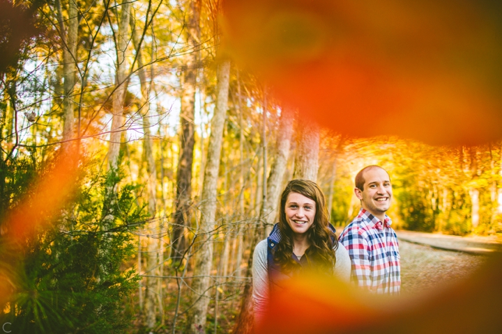 Couple standing in leaves