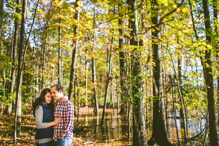 Couple standing in woods