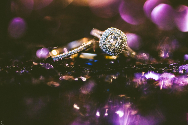 Wedding ring on purple sequins