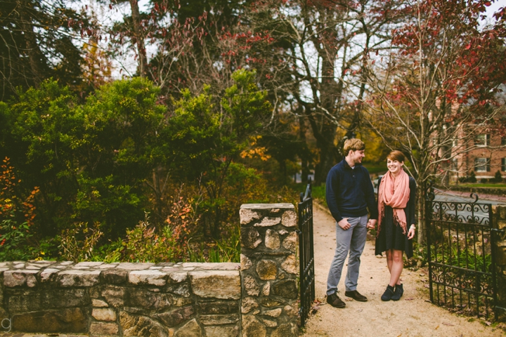 Engaged couple holding hands