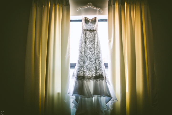 Bride dress hanging in window