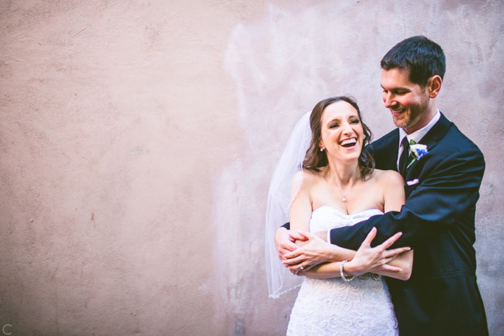 Husband and wife pose for wedding photographs