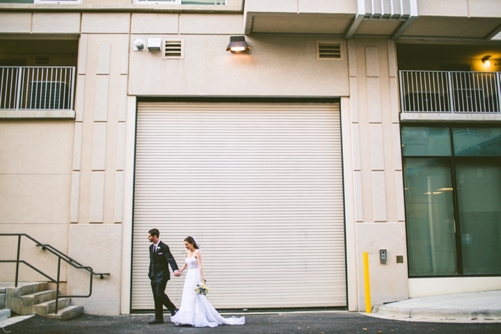 Husband and wife walking through downtown Raleigh