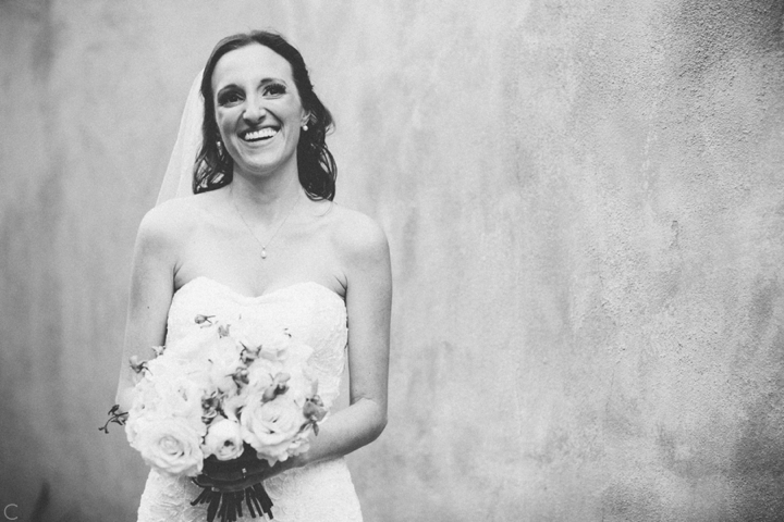 Bride laughing in black and white