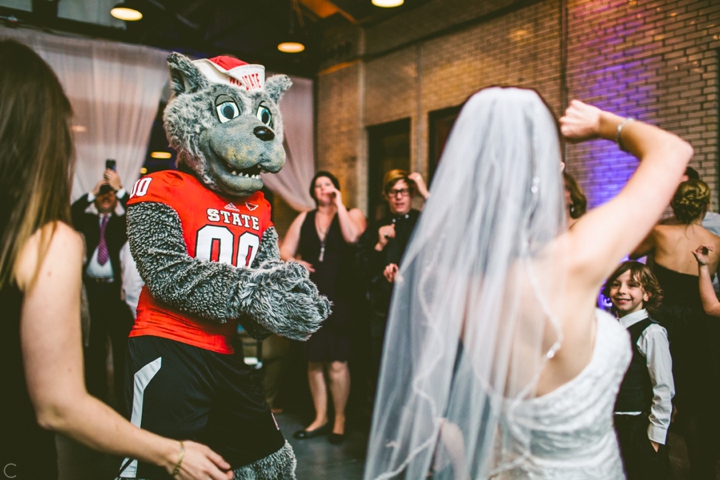 Mr. Wuf dancing with bride at wedding