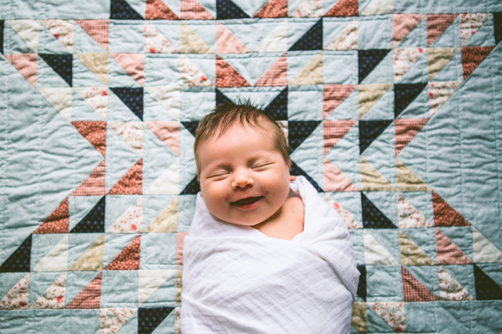 Smiling baby on blanket
