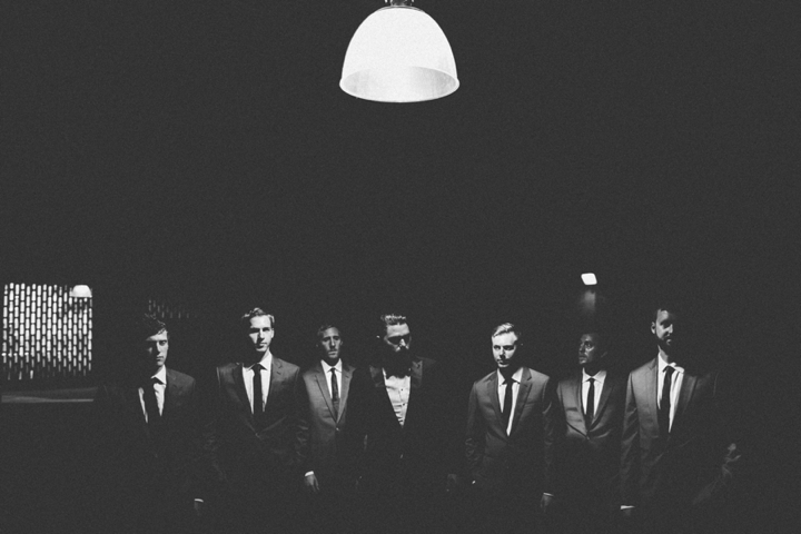 Groomsmen in parking garage photo