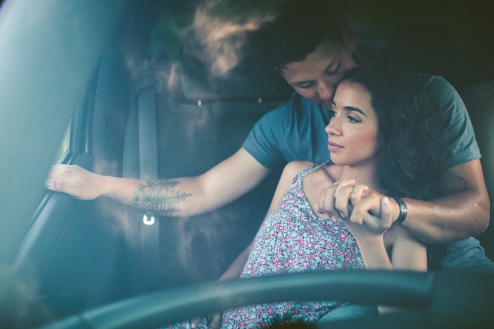 Couple sitting in truck for engagement session