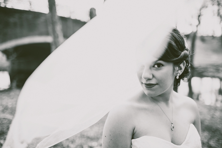 Bride with veil covering some of her face