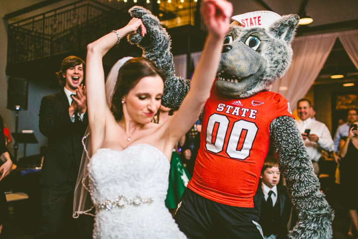 Bride dancing with NC State Mascot Mr Wuf