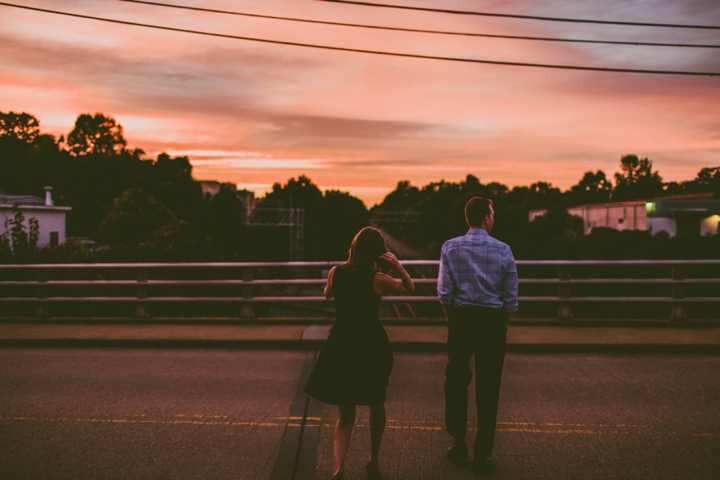 Couple walking across Boylan Bride in Raleigh