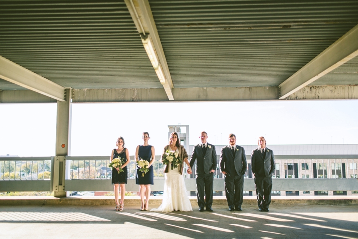 Wedding party standing in parking garage