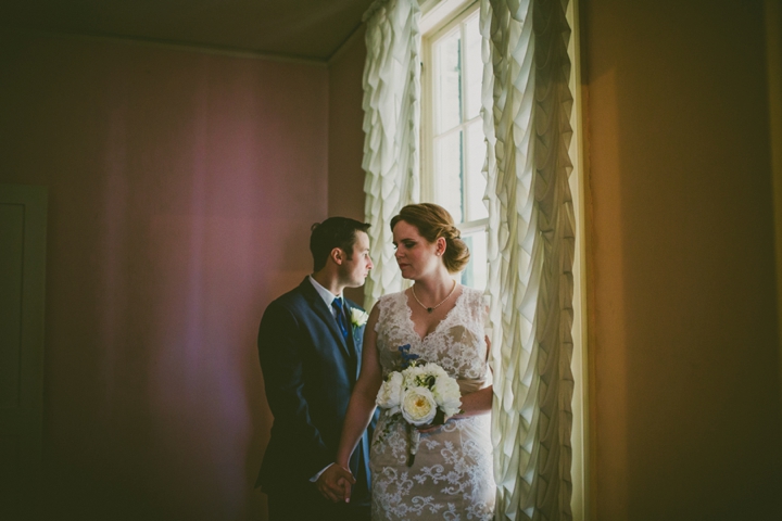 Couple standing together in window