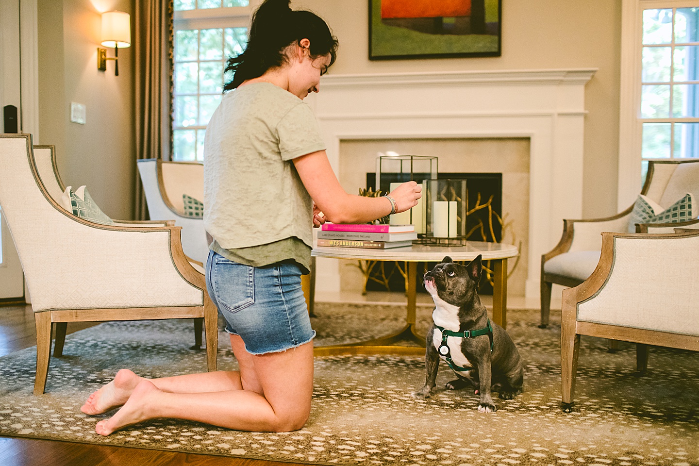 Girl feeding string cheese to a dog