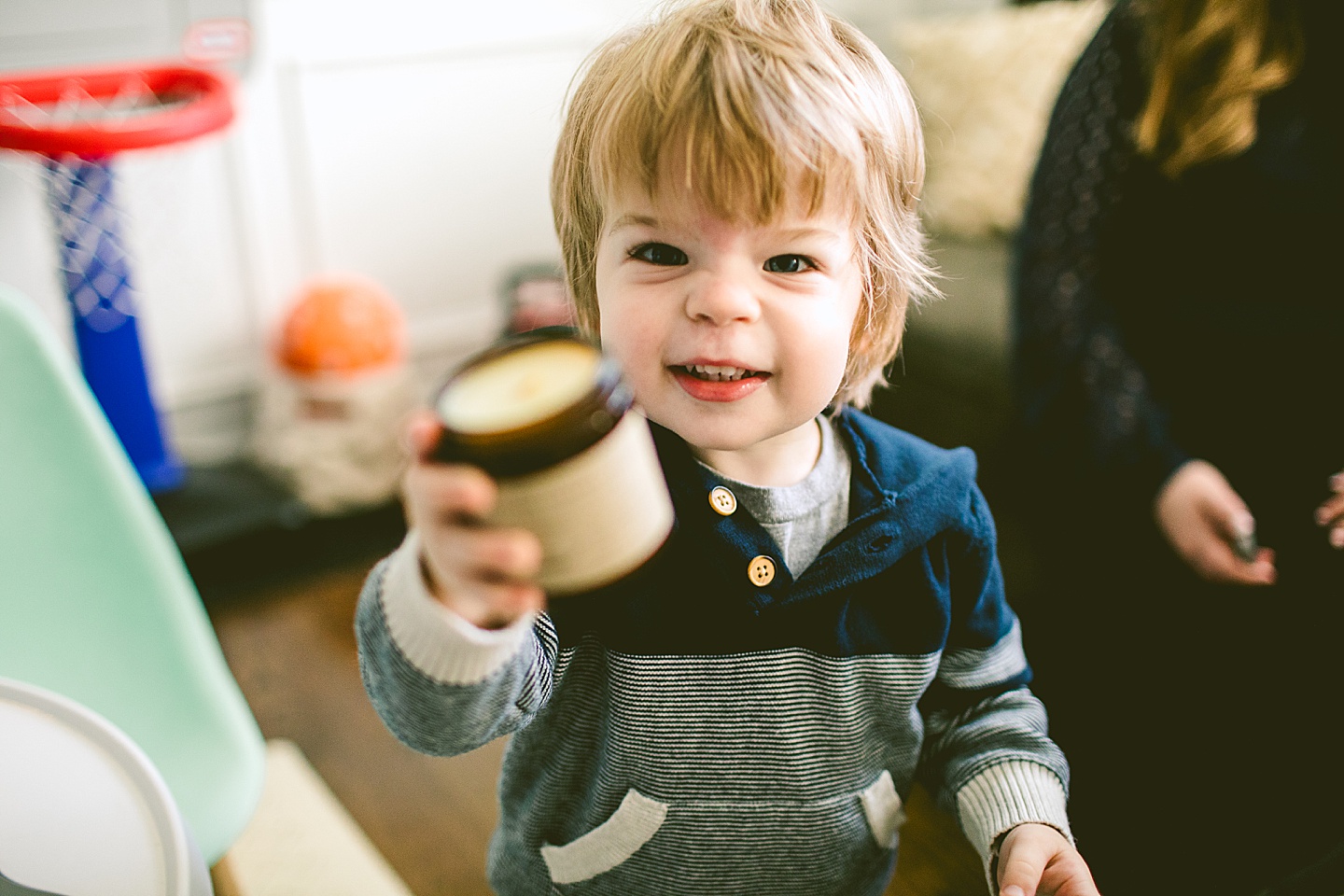 Child offering you a candle