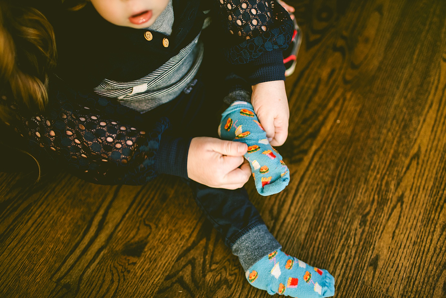 Kid putting on his socks