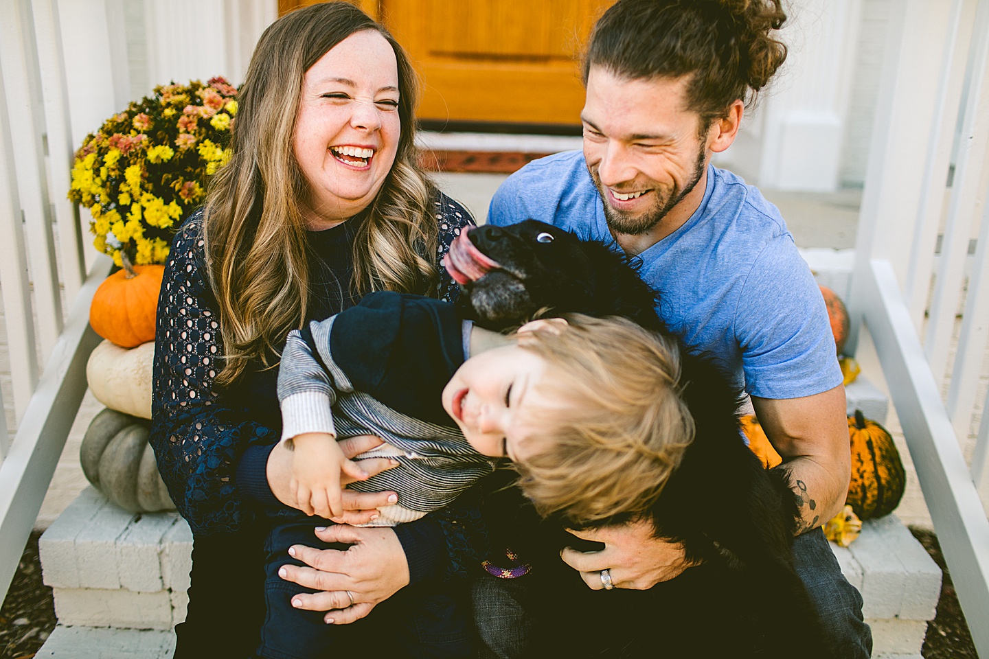 Family Christmas card on porch outtake