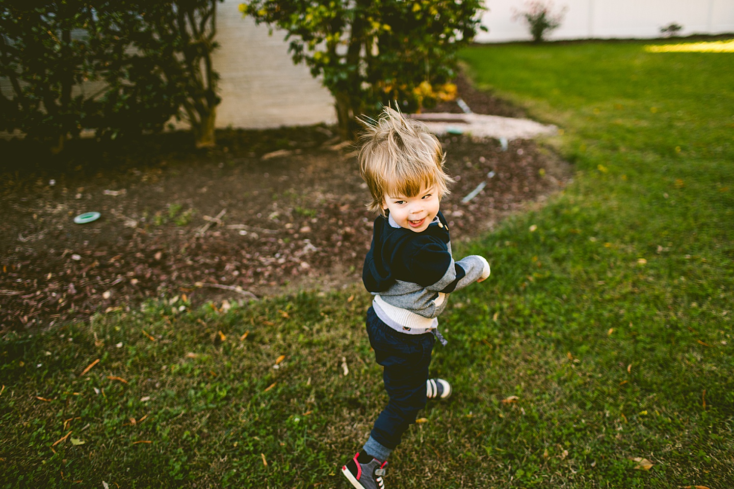 Kid running through the grass